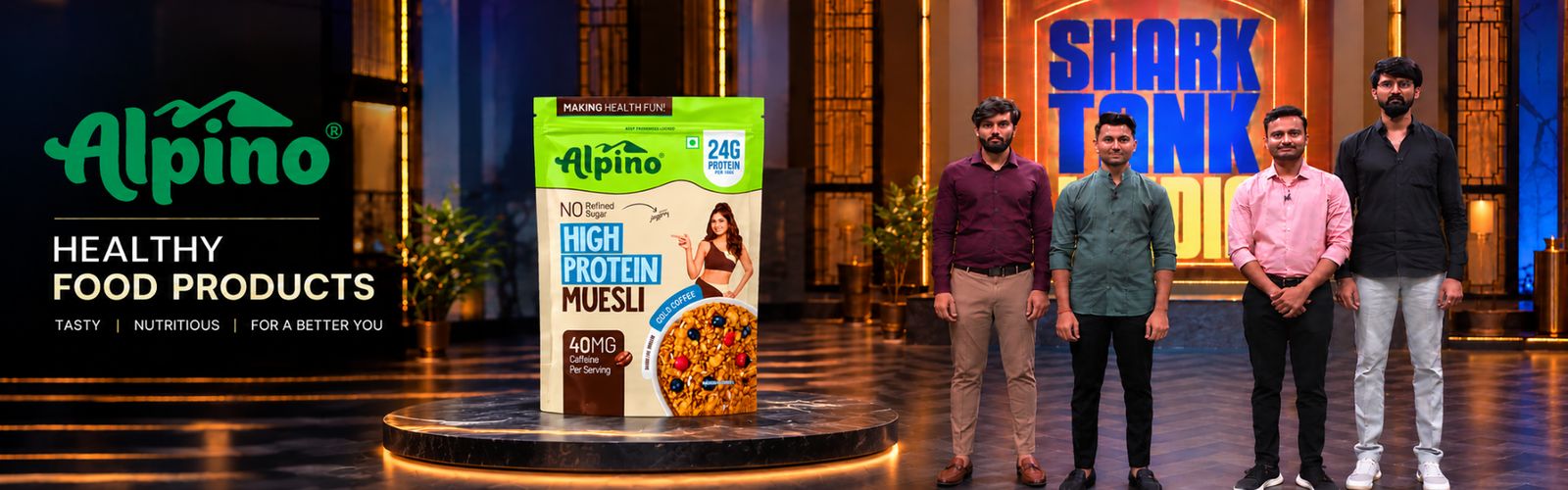 Alpino — healthy food products. A High Protein Muesli pack on display beside the Alpino team.
